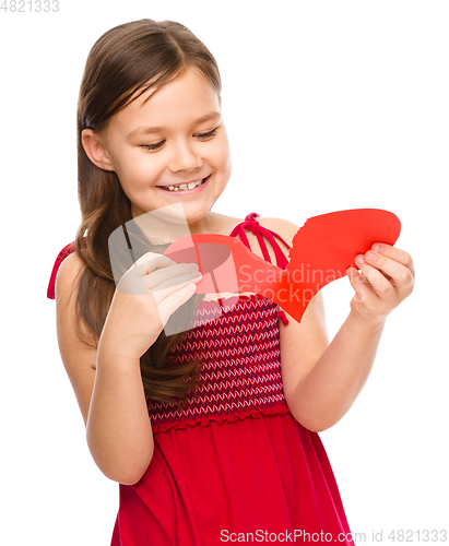 Image of Portrait of a happy little girl in red