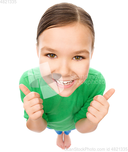 Image of Little girl is showing thumb up gesture