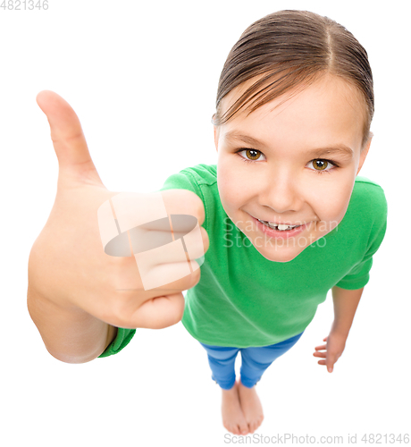 Image of Little girl is showing thumb up gesture