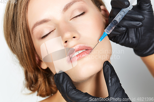 Image of girl getting beauty injection