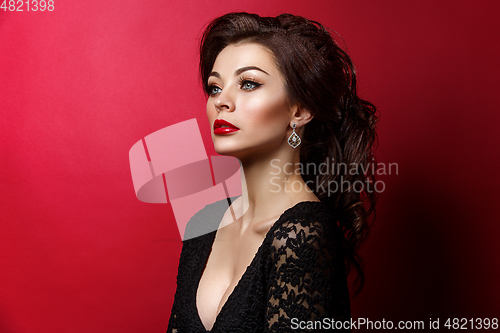 Image of beautiful young woman with red lips