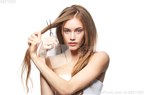 Image of beautiful girl getting haircut