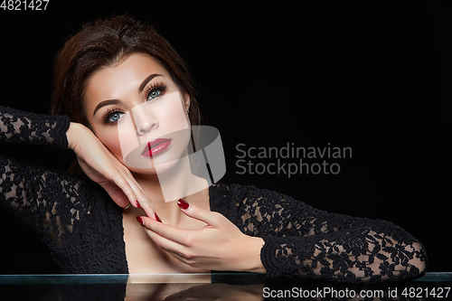 Image of beautiful young woman with red lips