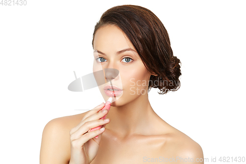 Image of girl applying lipgloss