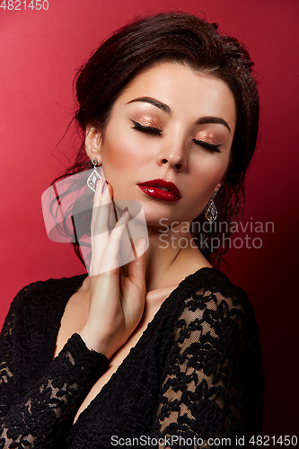 Image of beautiful young woman with red lips