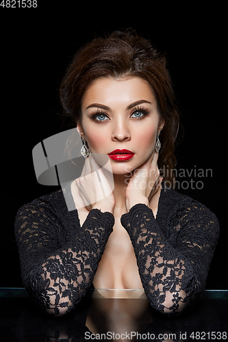 Image of beautiful young woman with red lips