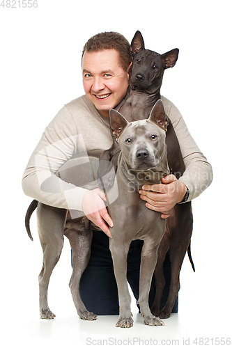 Image of man with two dogs