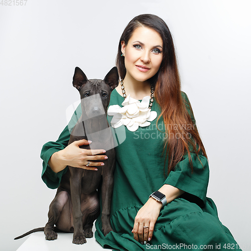 Image of woman with thai ridgeback puppy