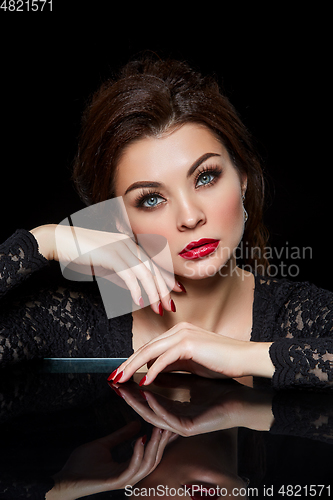 Image of beautiful young woman with red lips