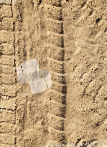 Image of tracks on sand