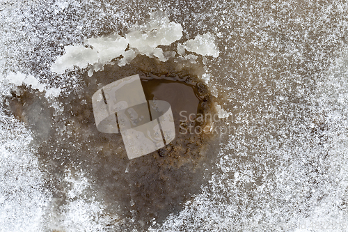 Image of hole in a ice