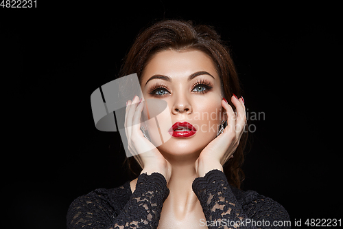 Image of beautiful young woman with red lips