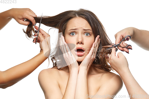 Image of beautiful girl getting haircut