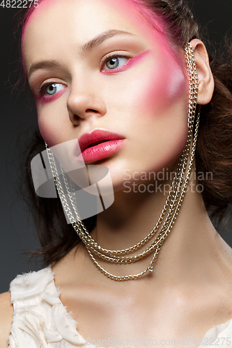 Image of beautiful girl with pink makeup
