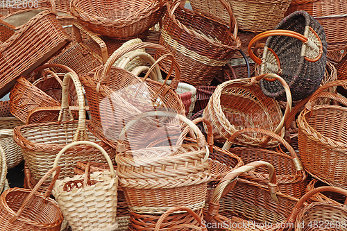 Image of Bunch of various empty wicker wooden baskets