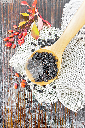 Image of Barberry dried in spoon on dark board top