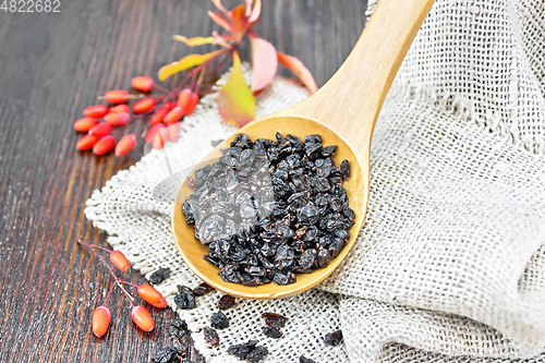 Image of Barberry dried in spoon on dark board