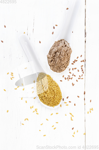 Image of Bran and flour flaxseed in spoons on white board top