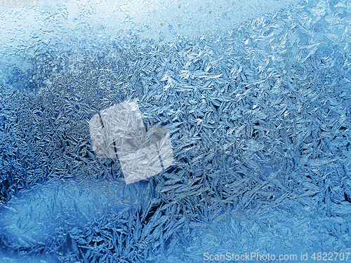 Image of Beautiful ice pattern and sunlight close-up on winter glass