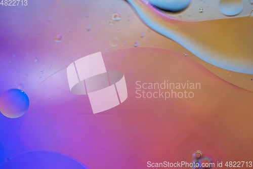 Image of Orange and purple abstract background picture made with oil, water and soap