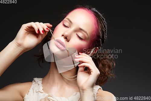 Image of beautiful girl with pink makeup