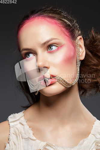 Image of beautiful girl with pink makeup