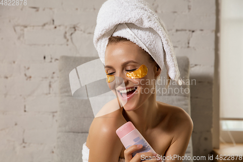 Image of Beauty Day. Woman doing her daily skincare routine at home