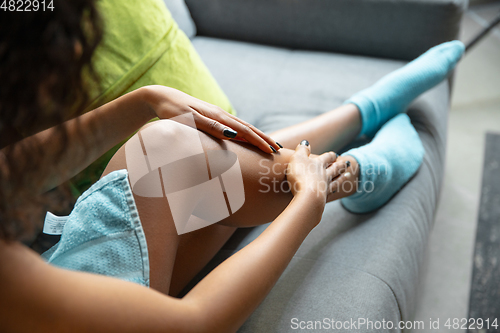 Image of Beauty Day. Woman doing her daily skincare routine at home