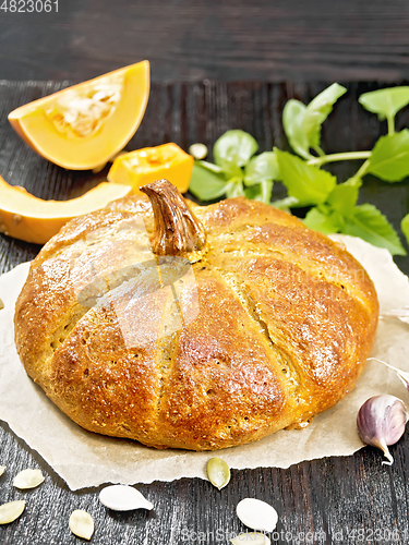 Image of Bread pumpkin on a black board