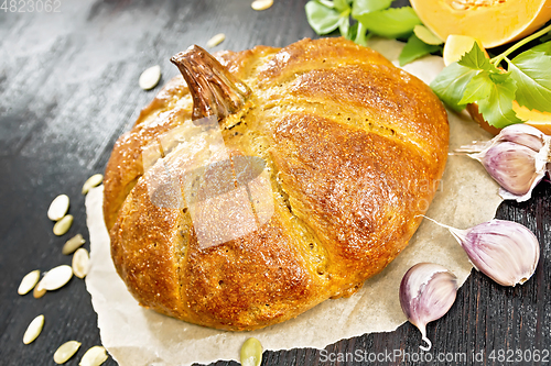 Image of Bread pumpkin on a dark wooden board