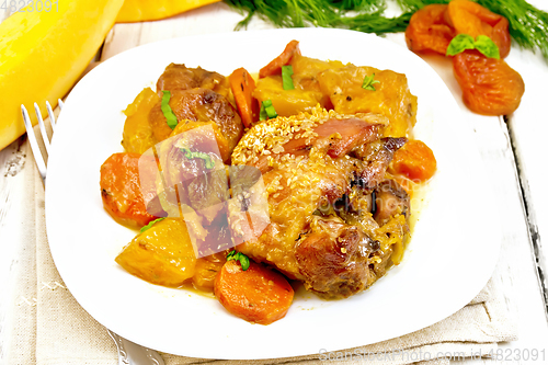 Image of Chicken roast with pumpkin and carrots on light board