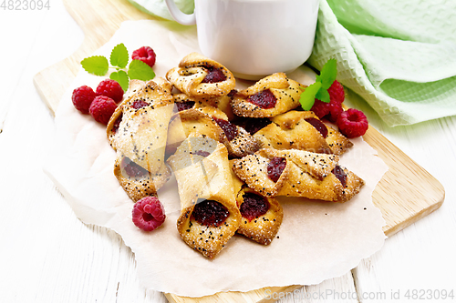 Image of Cookies with raspberries on board