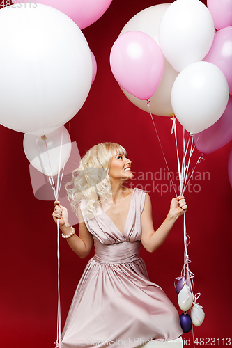 Image of beautiful girl with balloons