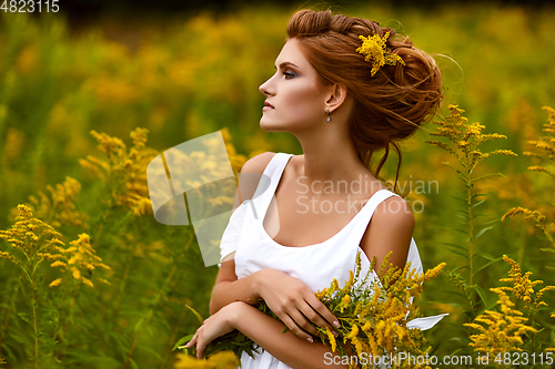 Image of beautiful girl in field