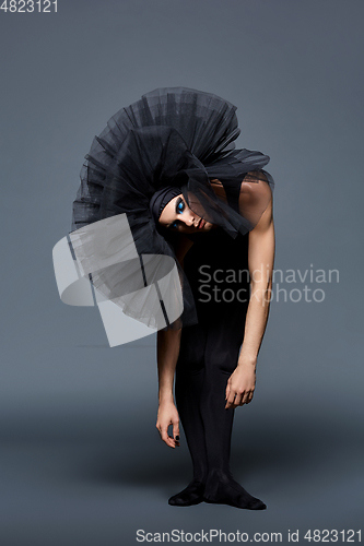 Image of handsome ballet artist in tutu skirt