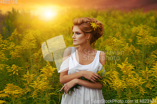 Image of beautiful girl in field