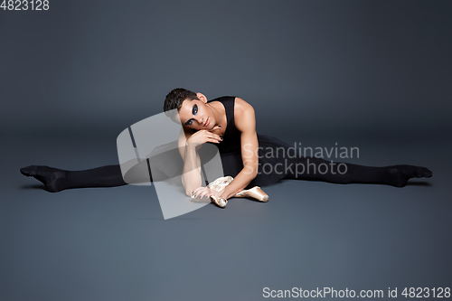 Image of handsome ballet artist in tutu skirt