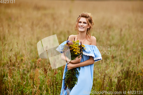 Image of beautiful girl in field