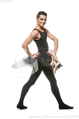 Image of handsome ballet artist in tutu skirt