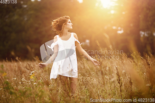 Image of beautiful girl in field