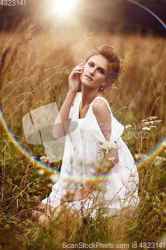 Image of beautiful girl in field