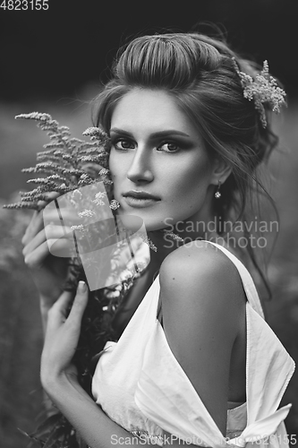 Image of beautiful girl in field