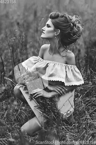 Image of beautiful girl in field