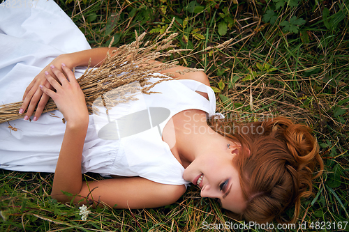 Image of beautiful girl in field