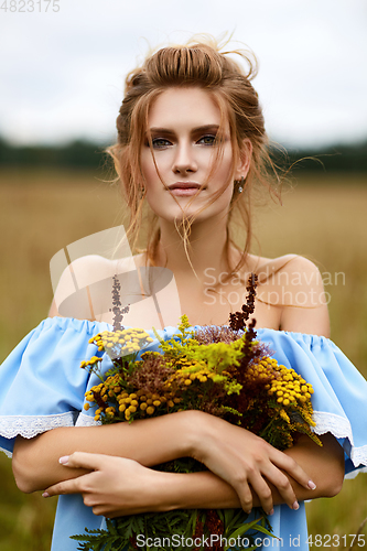 Image of beautiful girl in field