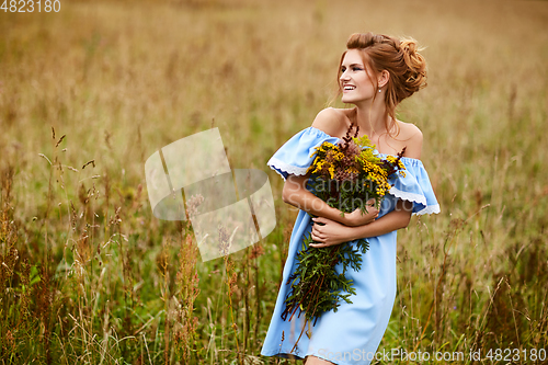 Image of beautiful girl in field