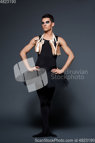 Image of handsome ballet artist in tutu skirt