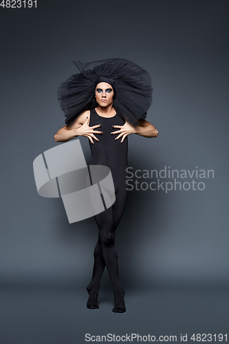 Image of handsome ballet artist in tutu skirt