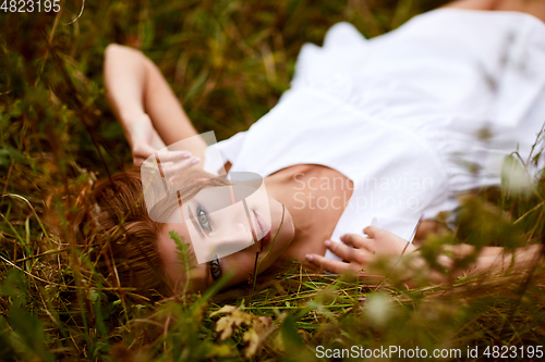 Image of beautiful girl in field