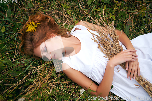 Image of beautiful girl in field